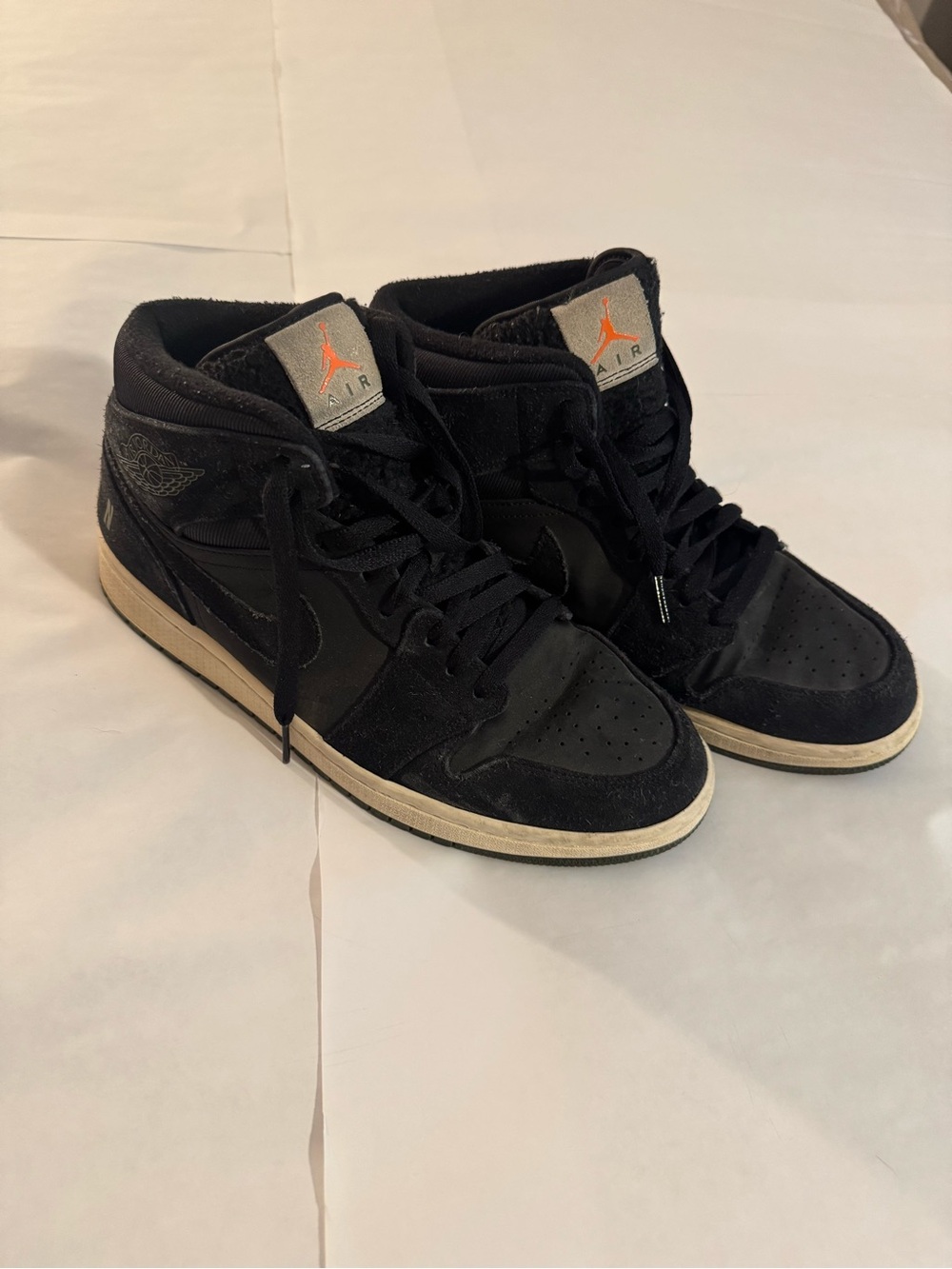 Jordan High-Top Sneakers in Black with Orange Accent